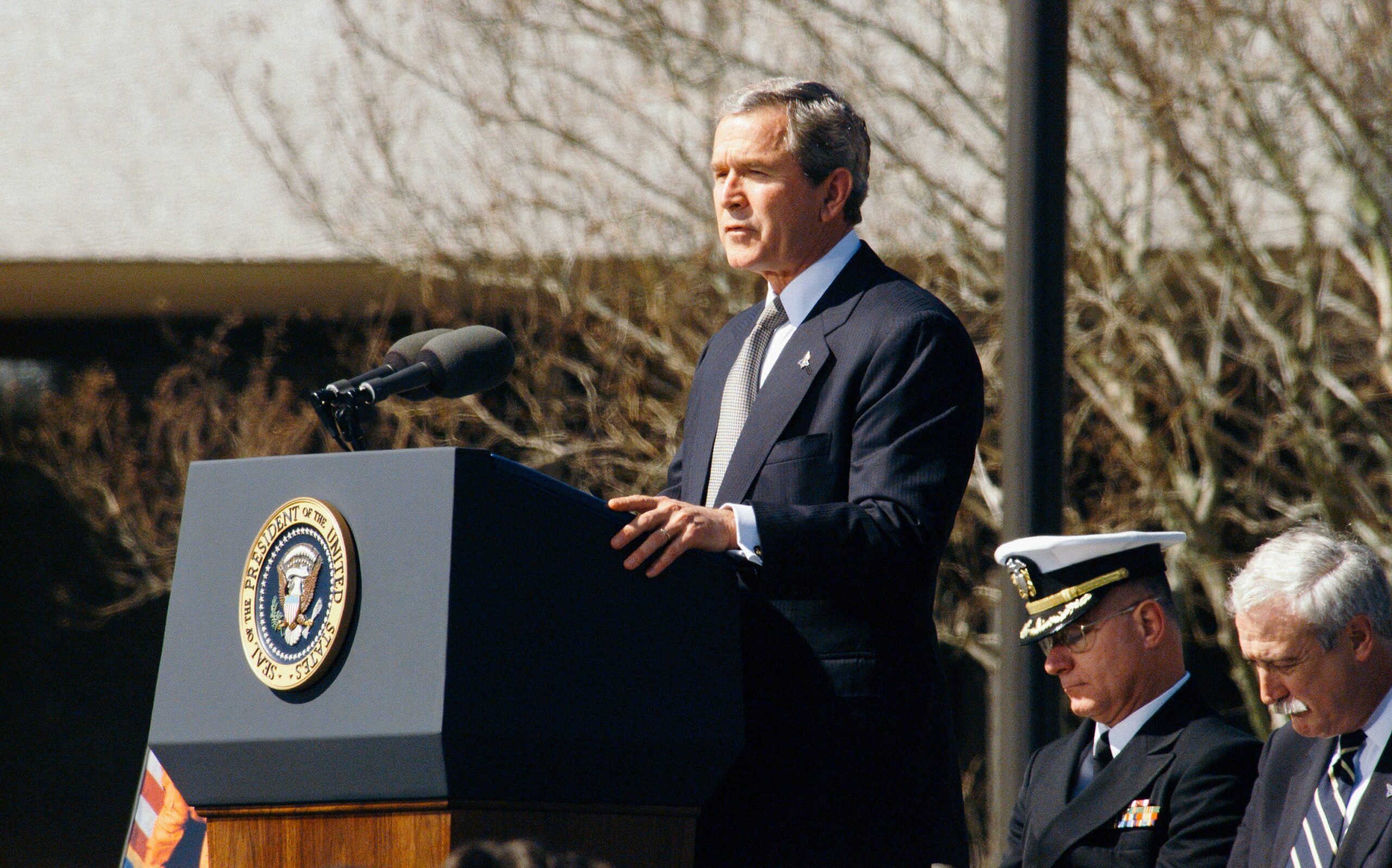 George W. Bush standing at podium